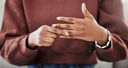 Image showing Wedding ring, hands and woman with divorce, decision and relationship doubt in her home. Jewelry, finger and female with marriage anxiety, commitment or fail in living room for choice regret in house