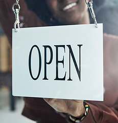 Image showing Store, window or open sign by happy person for small business, startup or restaurant poster advertising. Coffee shop, notice or manager by glass billboard news for cafe, service or entrepreneurship