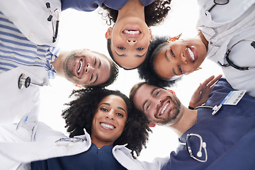 Image showing Happy people, portrait and doctors in huddle, teamwork or unity in healthcare mission together below. Low angle of excited group of medical professionals smile in team building, support or goals