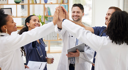 Image showing Doctors, teamwork and high five in meeting, motivation or success in healthcare together at hospital. Happy group of medical professionals touching in team building, support or goals at the clinic