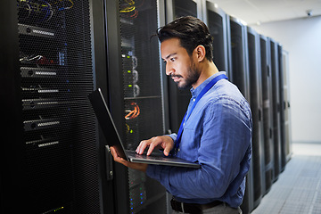 Image showing Programming, data center and a man with a laptop for maintenance, cyber security and internet check. Coding, email and an Asian programmer typing on a computer for network or server analytics