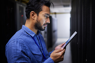 Image showing Tablet, man and reading in server room of technician programming at night. Information technology, focus and engineer in data center, cybersecurity network or coding software of system admin research