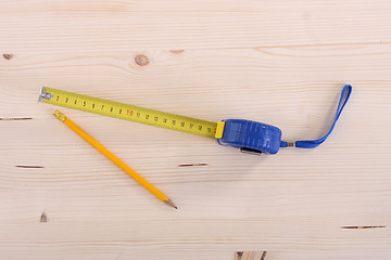 Image showing wooden plank and measuring tape 