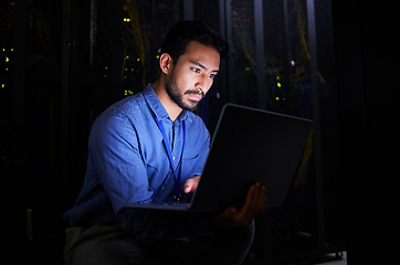 Image showing Night, server room or man typing for cybersecurity glitch, machine or internet servers system. IT support, data center or Asian engineer fixing network for information technology solution or research