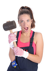 Image showing woman with black rubber mallet