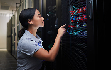 Image showing Woman, cable and engineer in server room to check inspection of cloud computing. Information technology, wire and technician in data center, networking in maintenance or cybersecurity of system admin