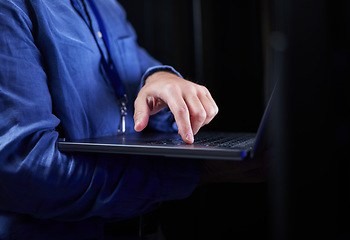 Image showing Hands, laptop and typing on keyboard for programming to work on project at night. Information technology, computer and person coding, networking and software developer of system admin on internet