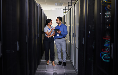 Image showing Talking, people and technician in server room with tablet for cybersecurity, update or team problem solving in data or coding. Engineer, teamwork and working with error in information technology code