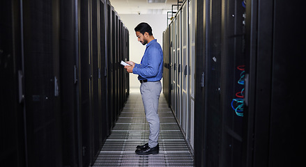 Image showing Tablet, man and technician in data center on research for programming at night. Information technology, inspection and engineer in server room reading, network maintenance or typing code for software