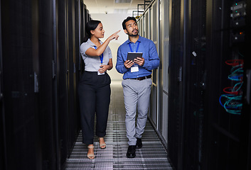 Image showing People, server room and inspection or teamwork for cybersecurity, engineering and coding solution on tablet. Engineering man and woman or manager walking and check data center with digital technology