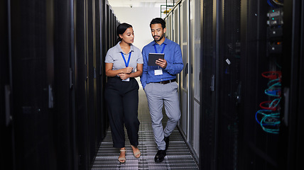 Image showing People, server room and teamwork on tablet, cybersecurity, engineering and programming or coding solution. Engineering man and woman or manager walking in data center, digital technology and training