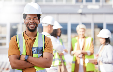 Image showing Black man, architect and arms crossed, construction site and maintenance, contractor job and smile in portrait. African engineer, confident and professional with urban infrastructure and renovation