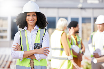 Image showing Woman, architect and arms crossed, construction site with maintenance, contractor job and smile in portrait outdoor. Professional, confident and civil engineering, urban infrastructure and renovation