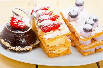 Image showing selection of fresh cream cake dessert plate