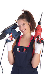 Image showing Beauty woman with auger and sander 