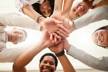 Image showing Office, team building and hands together from below in huddle for teamwork, collaboration and motivation at startup. Work, goals and diversity, group of people with business growth and staff support.