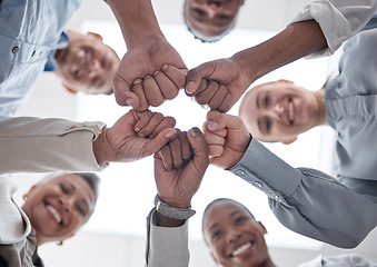 Image showing Hands fist bump, group circle and business people celebrate community support, synergy or happy corporate achievement. Below view, trust and staff commitment, solidarity and team building motivation