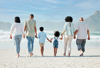 Image showing Back, beach and family holding hands, vacation and summer break with bonding, ocean and travel. People, grandparents and mother with father, children and love with seaside holiday, care and adventure