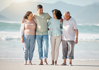 Image showing Happy family, beach and couple with senior parents hug, walk and bond in nature together. Walking, love and laughing elders with with man and woman at sea for retirement, travel and visit in Bali