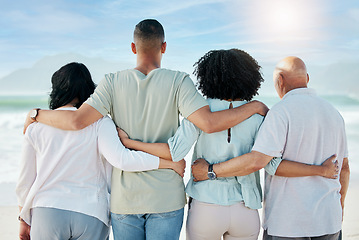 Image showing Back, hug and family at the beach for the view, ocean vacation and love in summer. Calm, nature and senior people with a man and woman for care and support in travel at the sea for a holiday together