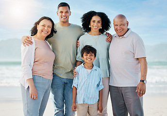 Image showing Portrait, grandparents and a family on the beach in summer together for holiday or vacation by the ocean. Love, nature or freedom with parents and children at the sea for bonding or weekend travel