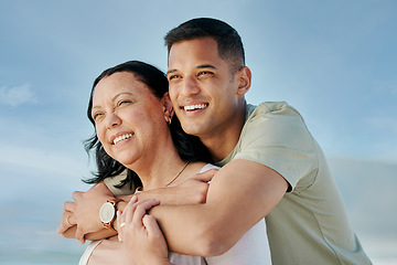 Image showing Love, hug and man with senior mother at beach happy, bond and relax in nature together. Face, smile and male with mom the ocean for freedom, travel and adventure, trip or family holiday in Mexico