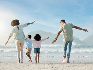 Image showing Playing, airplane and family on beach with freedom on vacation, holiday or summer in Brazil with parents and children. Mom, dad and kids play game as plane to fly for fun, bonding and happiness