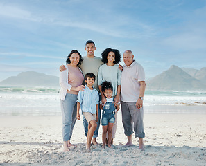 Image showing Portrait, children and a family on the beach in summer together for holiday or vacation by the ocean. Love, nature or freedom with parents and grandparents at the sea for bonding or weekend travel