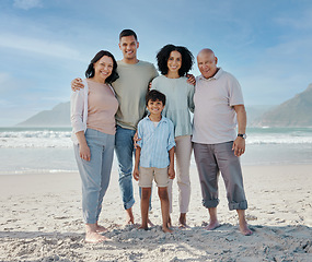 Image showing Portrait, grandparents and a family on the beach in nature together for holiday or vacation by the ocean. Love, summer or freedom with parents and children at the sea for bonding or weekend travel