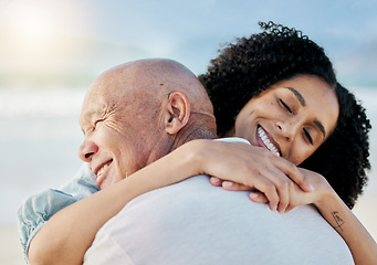 Image showing Hug, beach and woman with her senior father on family vacation, holiday or adventure. Happy, smile and young female person from Mexico embracing her elderly dad with love by the ocean on weekend trip