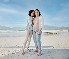 Image showing Hug, portrait and woman with mother at a beach happy, bond and relax in nature together. Love, smile and lady face with mom the ocean for freedom, travel and adventure trip at the sea in South Africa