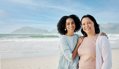 Image showing Portrait, hug and woman with mother at a beach happy, bond and relax in nature together. Love, smile and lady face with mom the ocean for freedom, travel and adventure trip at the sea in South Africa