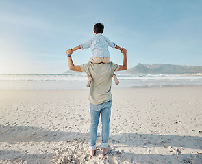 Image showing Dad, child on beach and piggy back together in summer waves on tropical island holiday in Hawaii. Fun, father and son on ocean vacation with love, support and relax at water with blue sky from back.