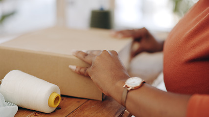 Image showing Black woman, hands and box in logistics for delivery, ecommerce or shipping cargo at office desk. Hand of African American female in small business packing product for shipment or courier service