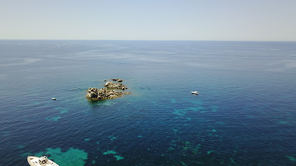 Image showing Ocean, landscape and island in water, sea or view of coral reef in tropical Mexico, travel or summer adventure on yacht. Aerial, drone and cruise to land with sailing, boat and blue world or nature