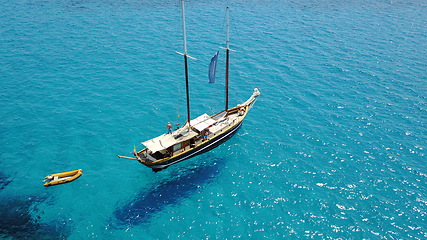 Image showing Yacht, sailing in Croatia and sun on ocean holiday, relax in freedom and nature with clean blue water from above. Boat vacation, travel in summer and tropical cruise on sea adventure with island fun.