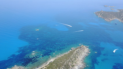 Image showing Ocean, landscape and above island in water, sea or view of coral reef in tropical Mexico, travel or summer adventure. Aerial, drone and cruise to land with beach, boat and blue world or nature