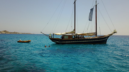 Image showing Yacht, sailing in Greece and summer on ocean holiday, relax in freedom and nature on blue water. Boat vacation, travel in sun and tropical cruise on sea adventure to island coast in beach transport.