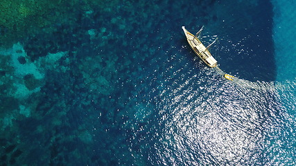 Image showing Aerial, boat and sailing in water, summer on ocean holiday and relax in freedom with nature from above. Yacht vacation, travel in Croatia and tropical cruise on sea adventure to island in sunshine.