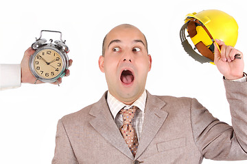 Image showing businessman looking at clock alarm
