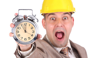 Image showing businessman looking at clock alarm