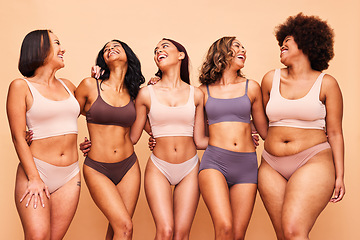 Image showing Body positive, happy and women in studio in underwear for wellness, beauty and self love campaign. Diversity, natural skin and people in lingerie on brown background for confident, pride or inclusion