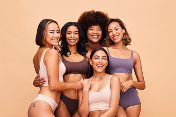 Image showing Body portrait, underwear and group of women in studio isolated on a brown background. Smile, lingerie and friends with empowerment, inclusion and positivity, natural beauty and wellness for diversity