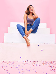 Image showing Happy woman, confetti and steps portrait with smile, style and fashion with celebration sparkle. Studio, pink background and female model with party and birthday decoration with gen z confidence