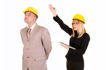Image showing businesswoman and architect looking up