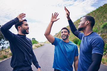 Image showing Happy, men and friends high five for fitness, workout and running outdoor with a smile. Exercise, training and sports with motivation and success together on a road with wellness and excited support