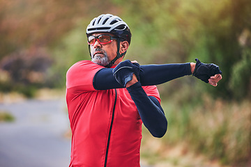 Image showing Man, cyclist and stretching arms on mountain in sports fitness, workout or outdoor exercise in nature. Active male person or athlete in body warm up, cycling or ready for cardio marathon or training