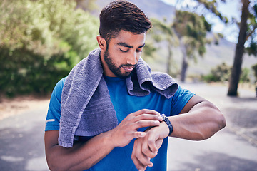 Image showing Pulse check, man and fitness watch with training results, towel and time monitoring of run outdoor. Runner, workout app, heart rate and athlete progress for sport and exercise on a road for health