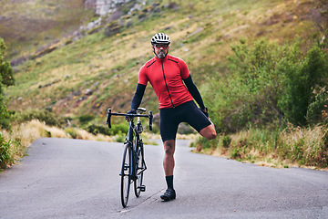 Image showing Road, bike and man stretching, fitness and exercise with training, warm up and outdoor sports with wellness. Person, cyclist or athlete stretch, workout and nature with health, performance and cardio