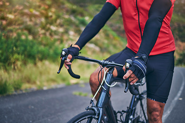 Image showing Fitness, cycling and hands with person on bike in nature for sports, training or challenge. Exercise, workout and health with closeup of man on bicycle in mountains for energy, freedom or performance